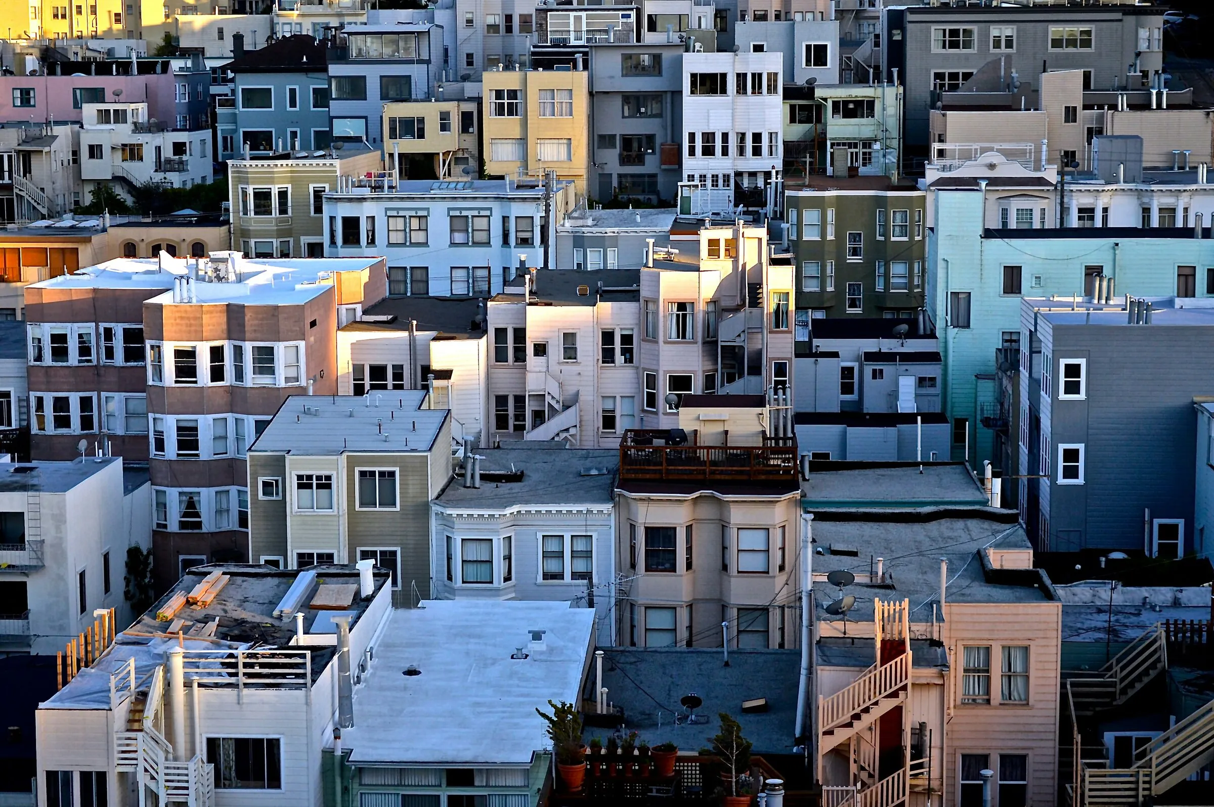 Aerial view of a dense neighborhood of colorful houses