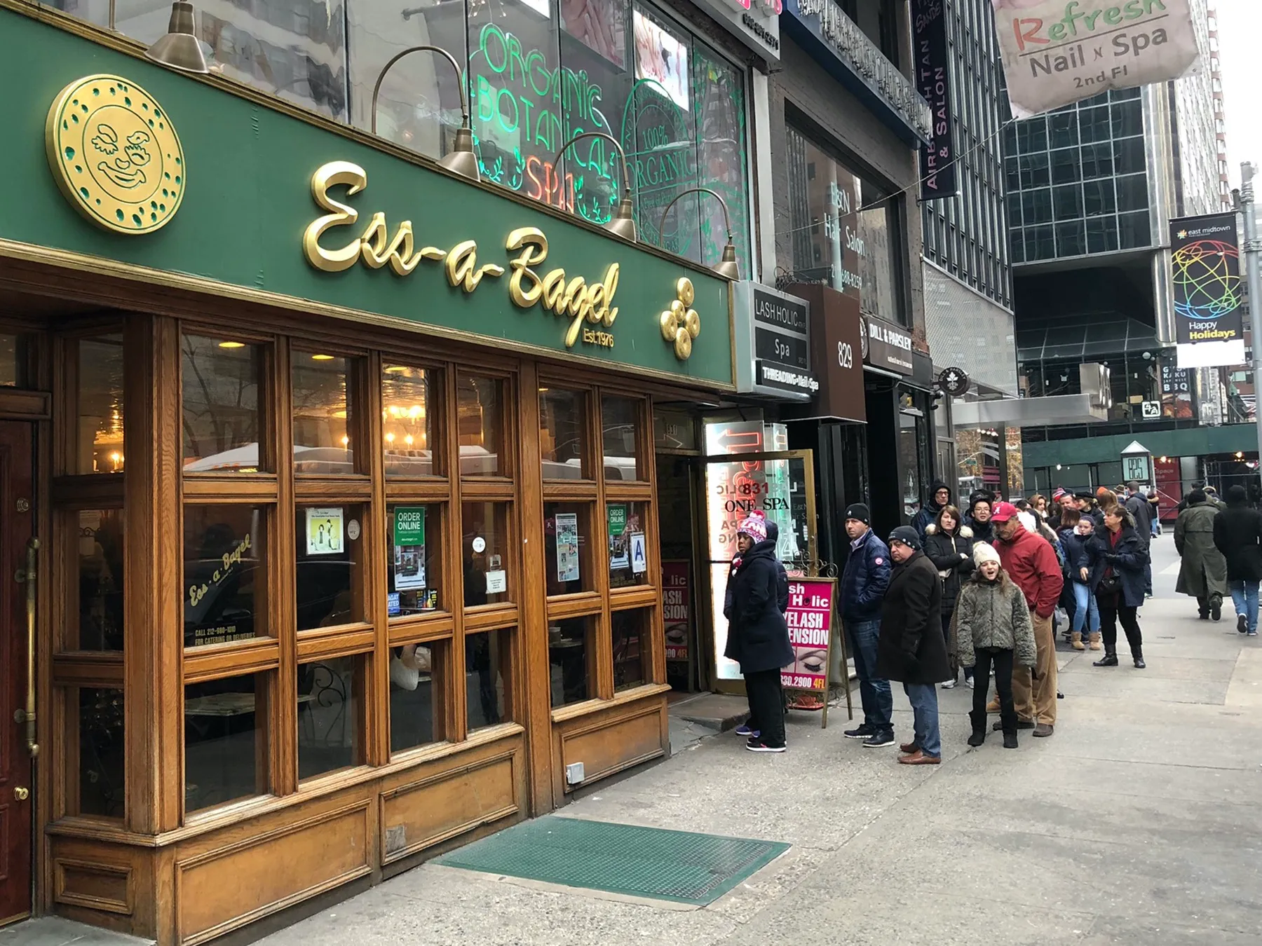 People wait in line outside Ess-a-Bagel in New York City
