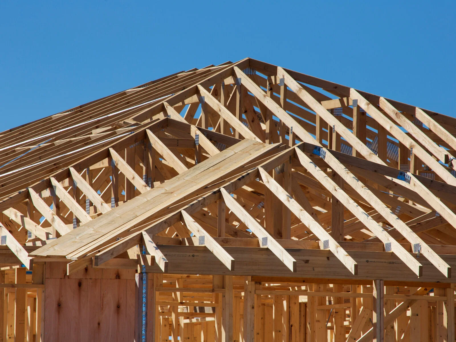 Residential construction site with wood framing in progress